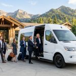 Luxury guest shuttle arriving at a Utah mountain estate for a wedding retreat.